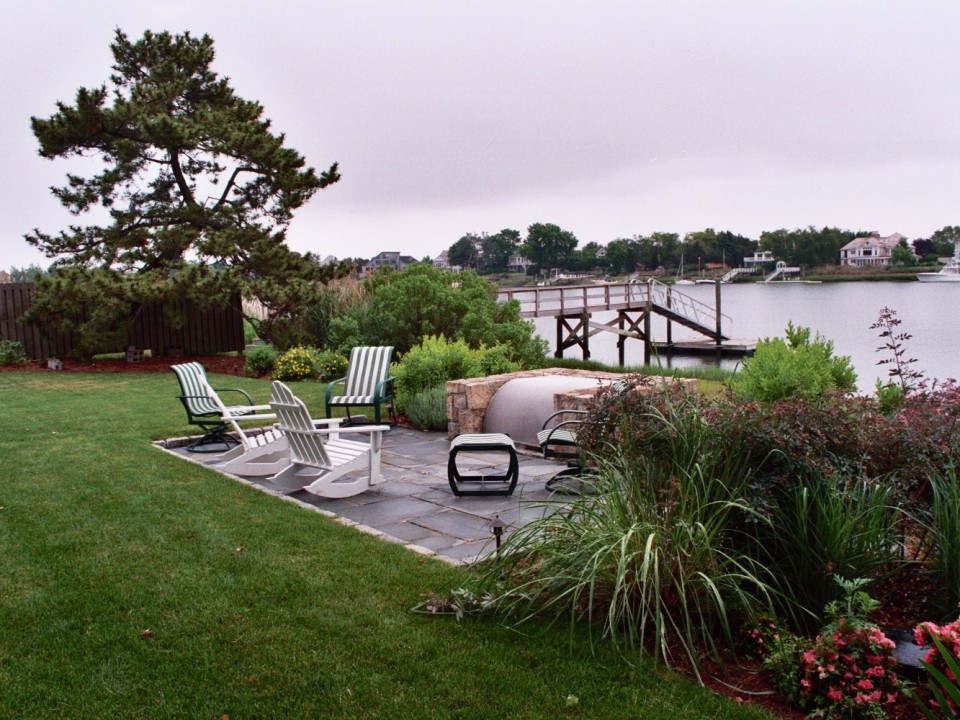 Bluestone patio with outdoor fireplace and stainless steel cover